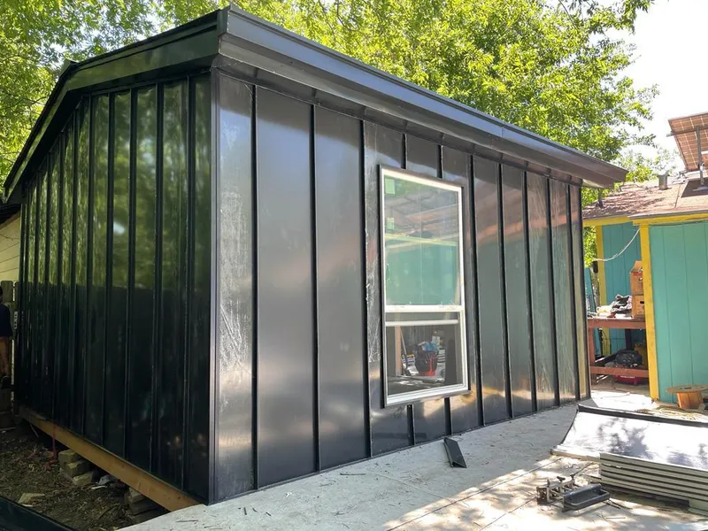 Black standing seam metal wall panels for Metal Roof Installation in Fort Gratiot